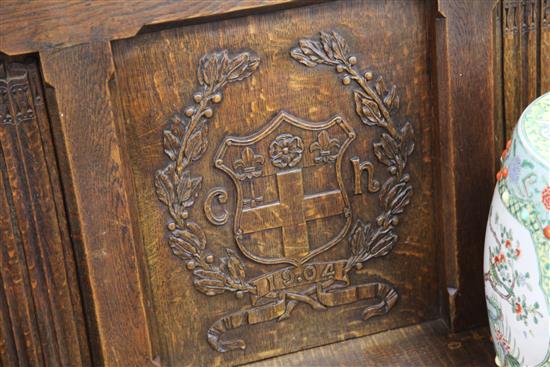 An Edwardian carved oak bench seat, formerly from Christs Hospital, Sussex, W.7ft